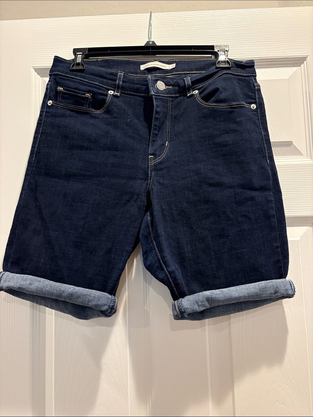 Levi's dark indigo denim bermuda shorts with tan stitching